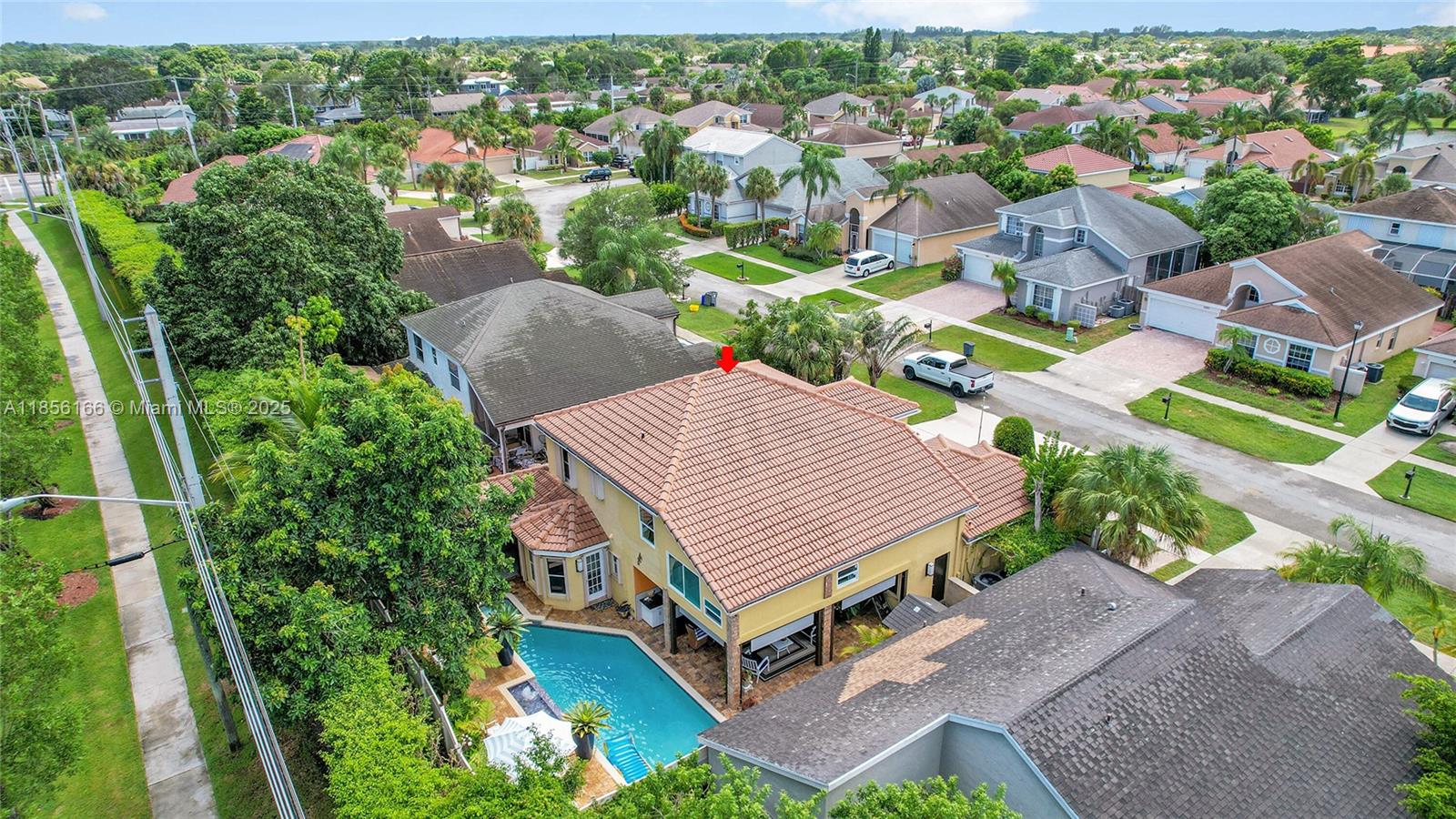 9398 Aegean Drive Boca Raton, FL 33496 - Photo 58 of 61 an aerial view of a house with a garden