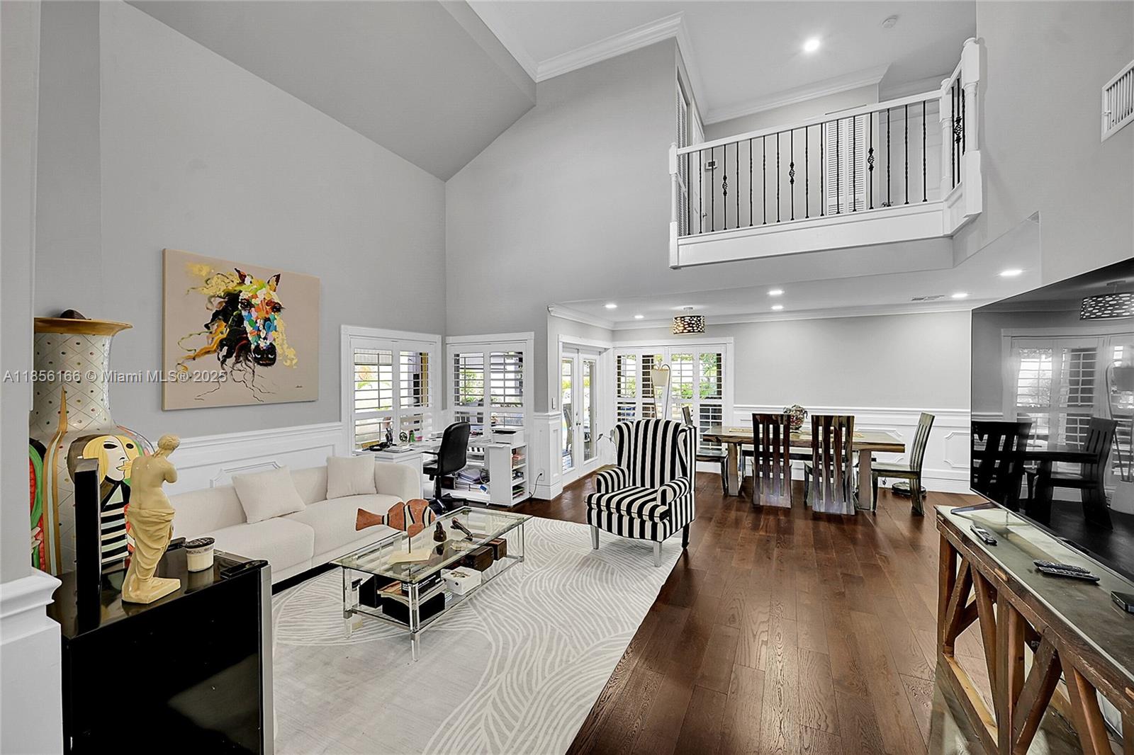 9398 Aegean Drive Boca Raton, FL 33496 - Photo 6 of 61 a living room with furniture kitchen view and a large window