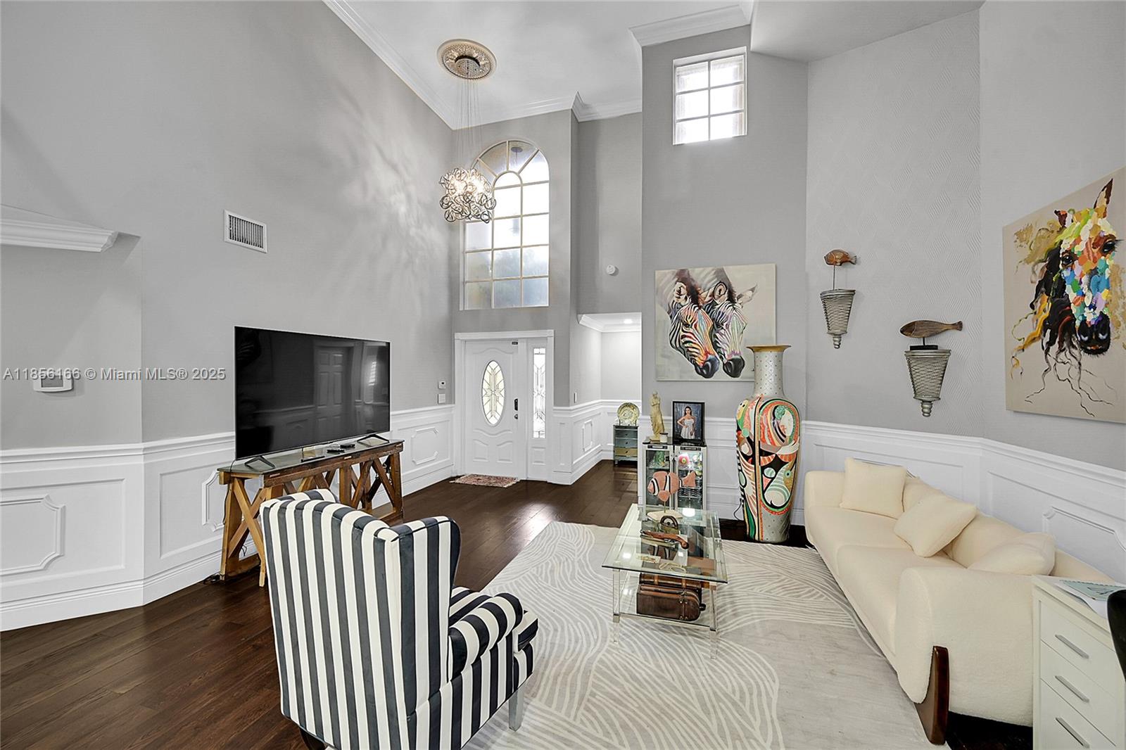 9398 Aegean Drive Boca Raton, FL 33496 - Photo 8 of 61 a bedroom with furniture and a flat screen tv