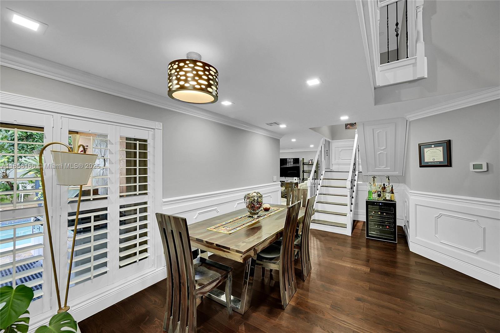 9398 Aegean Drive Boca Raton, FL 33496 - Photo 10 of 61 a view of a dining room with furniture and wooden floor