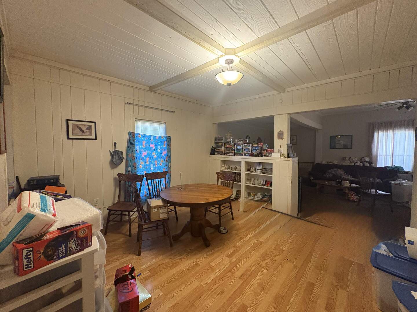 1615 West Chestnut Street Marion, IL 62959 - Photo 6 of 18 a living room with furniture a flat screen tv and a dining table