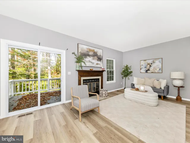 a bedroom with furniture and a fireplace