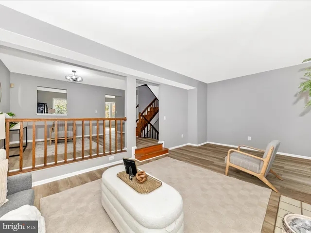 a bedroom with furniture and stairs