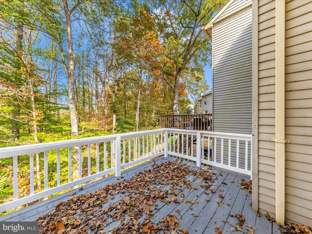 a view of a balcony with wooden floor