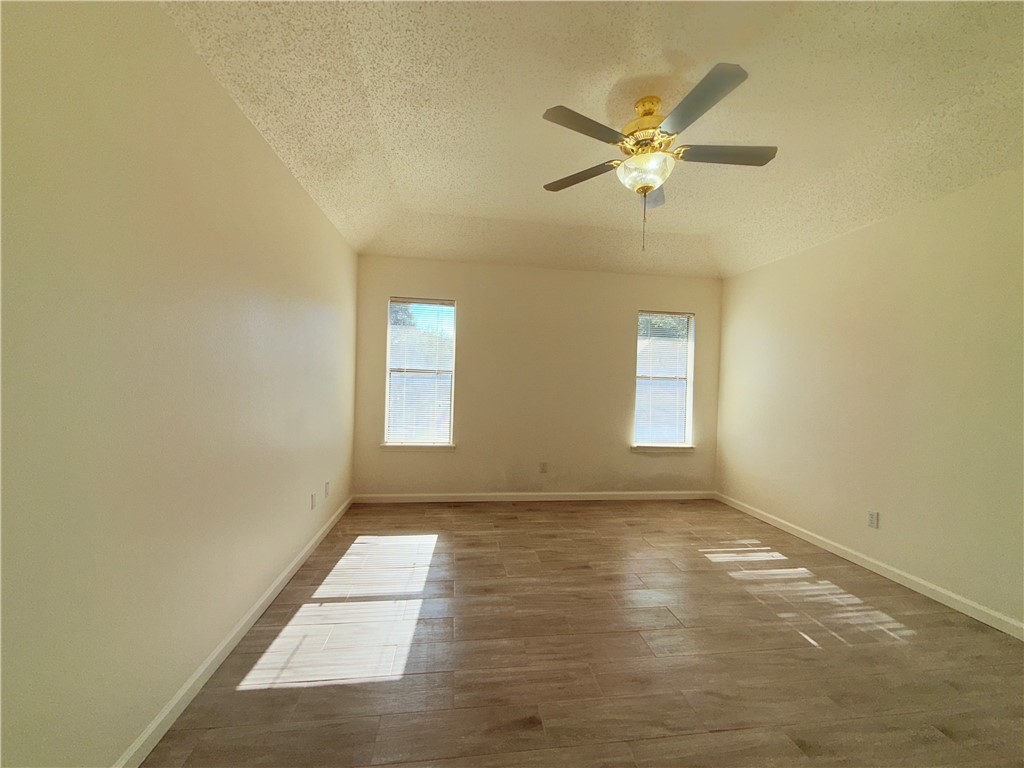 2229 Pebble Beach Drive Ingleside, TX 78362 - Photo 21 of 33 a view of empty room with wooden floor and fan