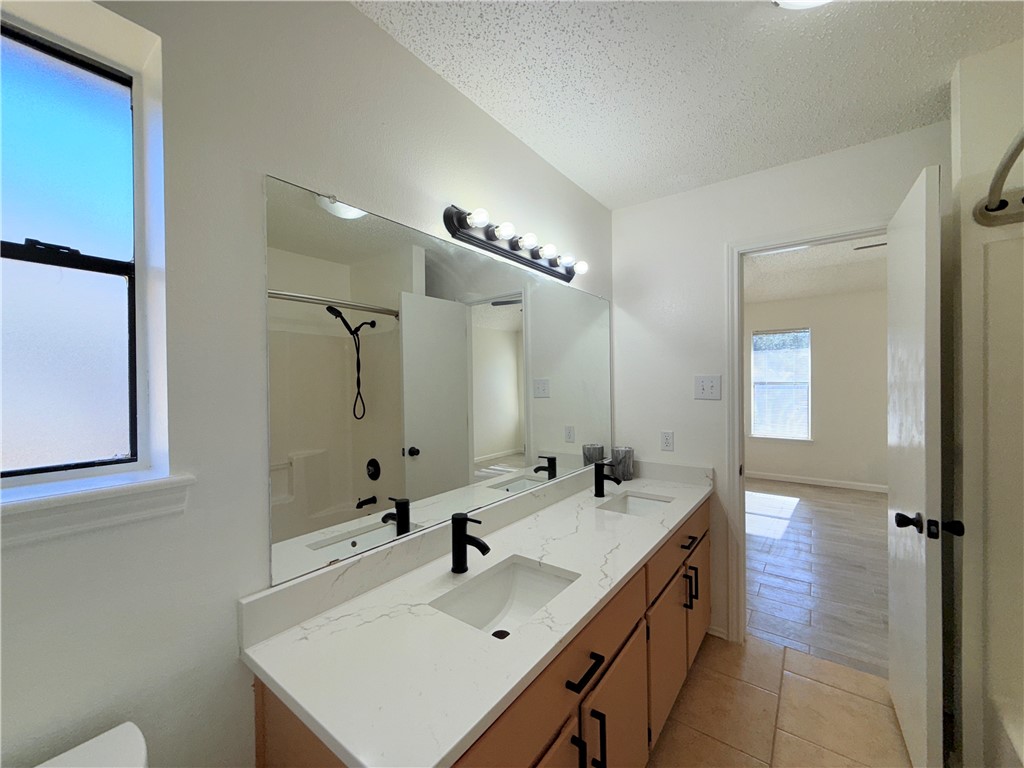 2229 Pebble Beach Drive Ingleside, TX 78362 - Photo 24 of 33 a bathroom with a sink and a mirror