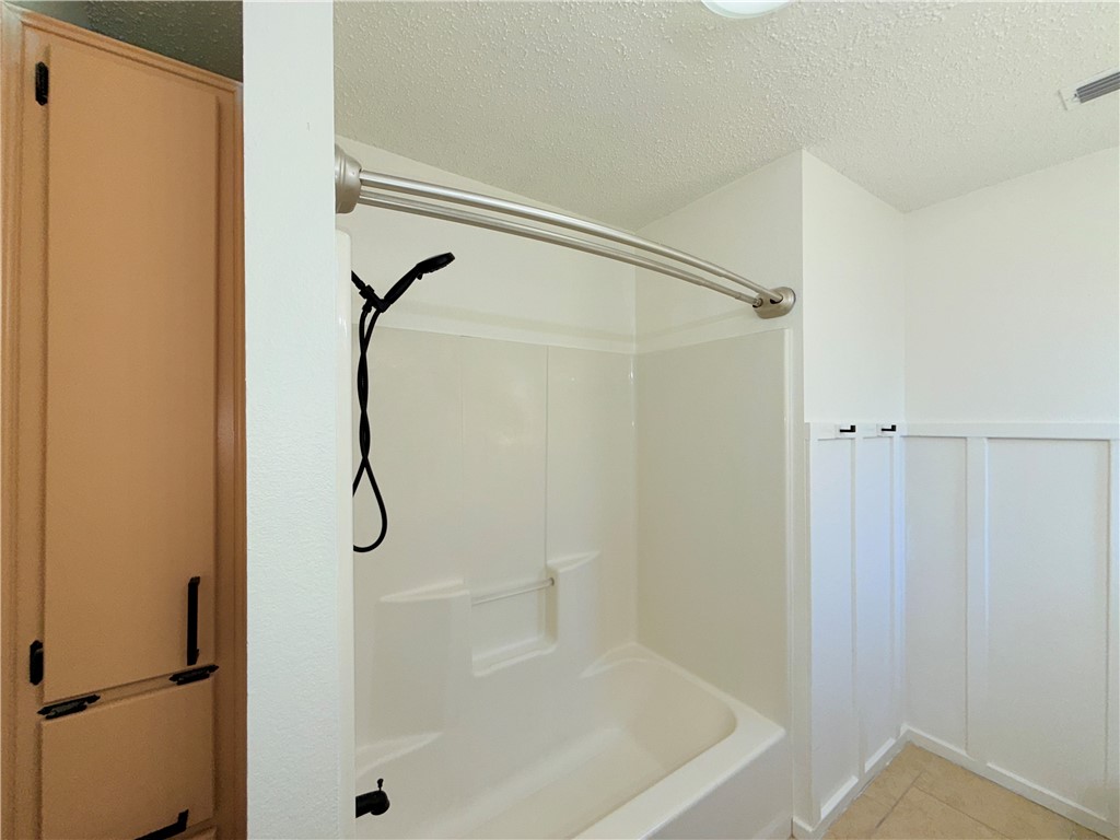 2229 Pebble Beach Drive Ingleside, TX 78362 - Photo 26 of 33 a bathroom with a shower and a glass door