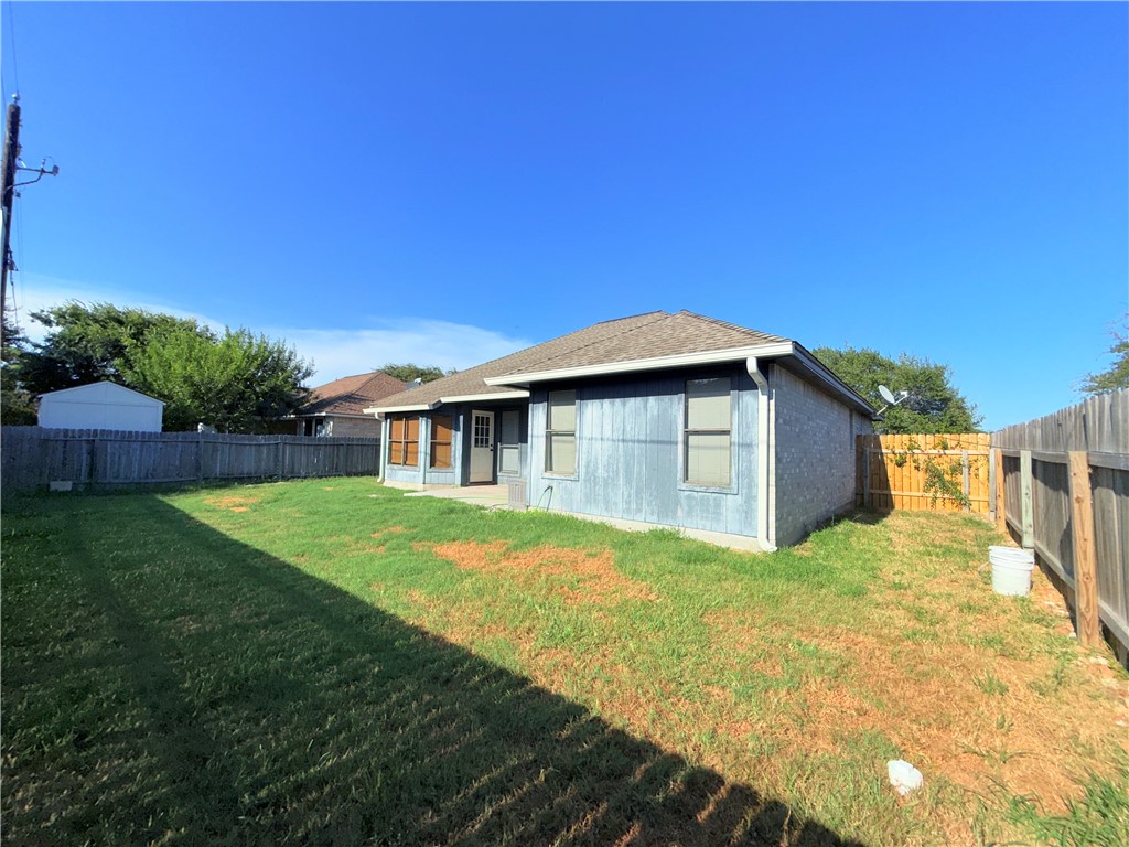2229 Pebble Beach Drive Ingleside, TX 78362 - Photo 30 of 33 a yellow house with a big yard