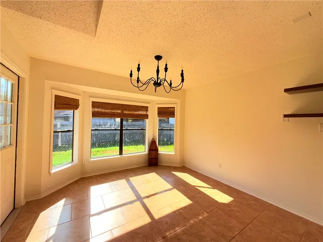 a view of a living room with a large window