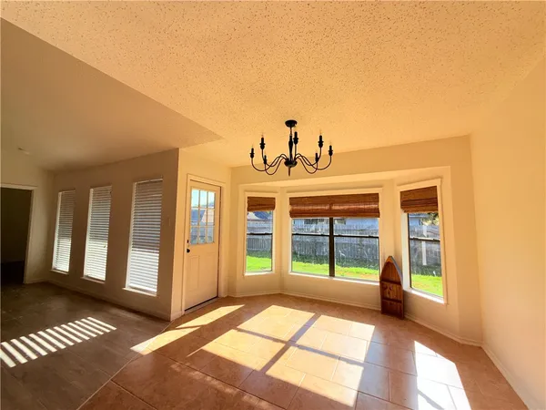 a view of a room with large windows