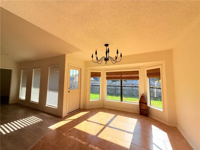 a view of a room with large windows