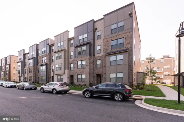a car parked in front of a brick building