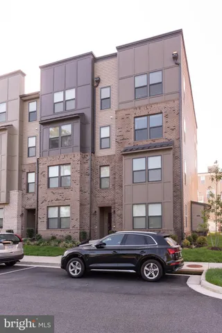 a car parked in front of a big building