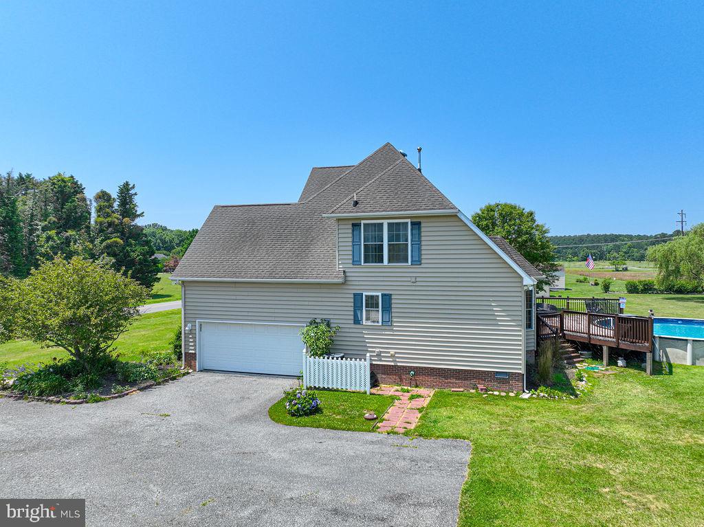 10671 Cathell Road Berlin, MD 21811 - Photo 59 of 63 a front view of a house with a garden
