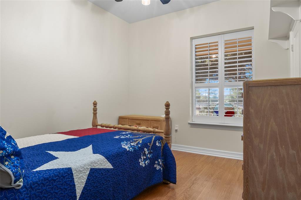 4451 Shiloh Road Midlothian, TX 76065 - Photo 20 of 39 Bedroom number 3 has 10 foot ceilings and plantation shutters. All downstairs bedrooms closets have 3 levels of hanging space.