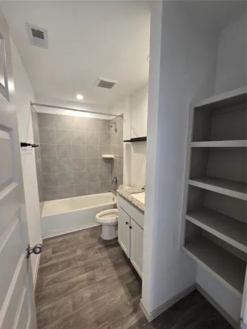 a bathroom with a bathtub toilet and sink