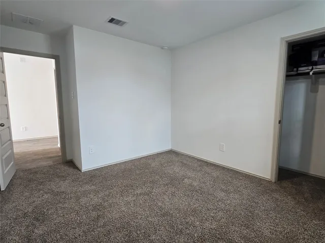 a kitchen with stainless steel appliances granite countertop a stove and a refrigerator