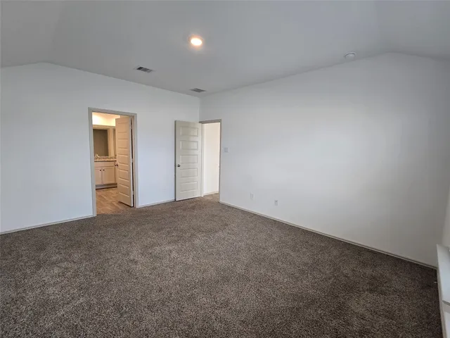 a bathroom with a granite countertop sink a mirror and a shower