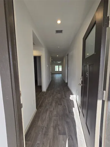 a view of gallery with wooden floor