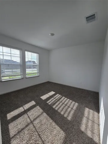 a view of an empty room and window