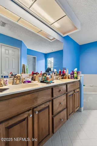 a kitchen with cabinets a sink and appliances