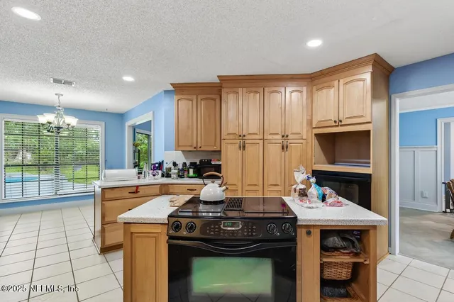 a kitchen with a stove and a refrigerator