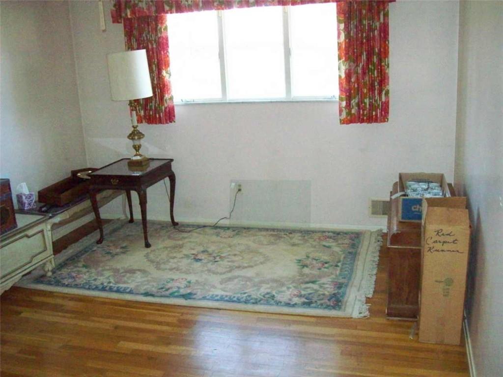 124 Herbst Road Coraopolis, PA 15108 - Photo 12 of 24 a room with water heater and a wooden floor