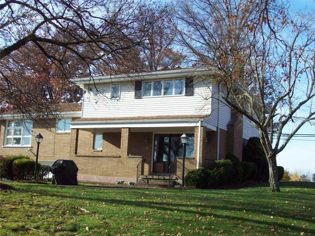 124 Herbst Road Coraopolis, PA 15108 - Photo 3 of 24 front view of a house with a yard