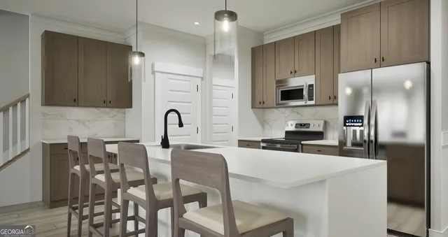 a kitchen with stainless steel appliances a refrigerator a stove a sink and chairs