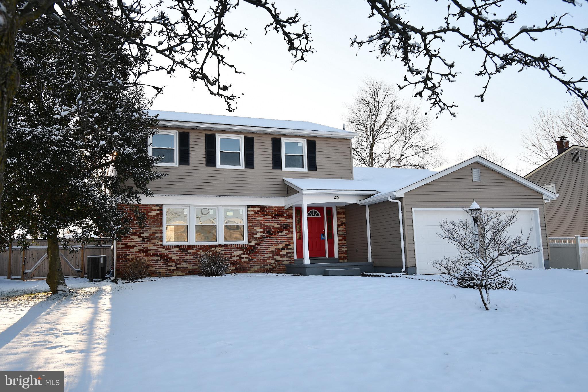 Charming home nestled in a winter wonderland.