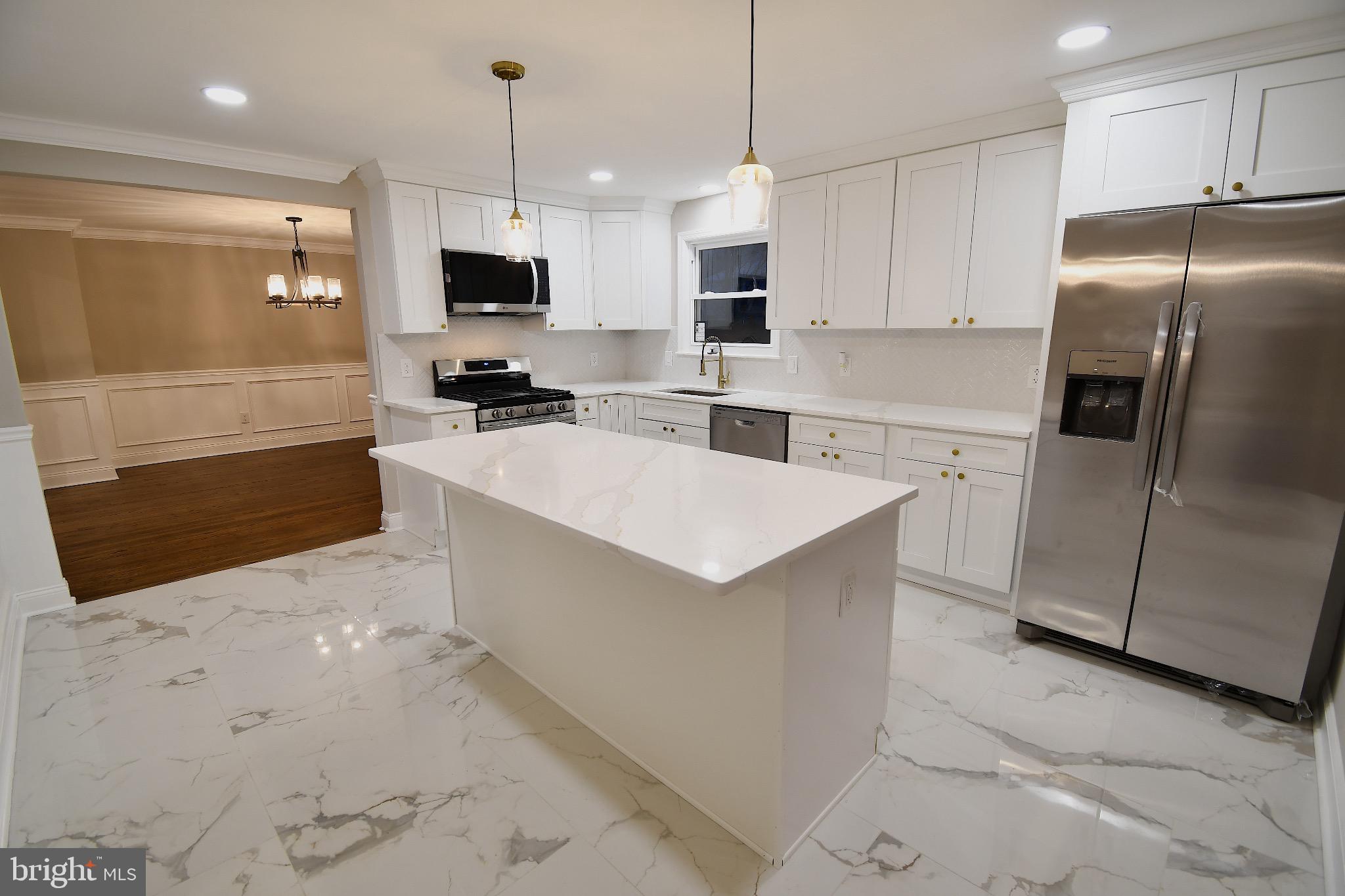25 Champlain Road Marlton, NJ 08053 - Photo 14 of 40 Modern kitchen with elegant marble floors.