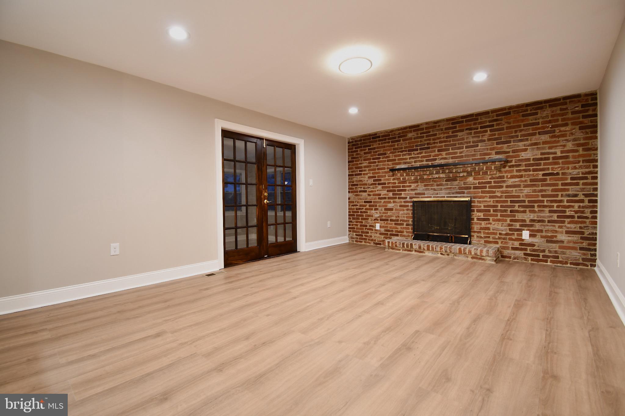 25 Champlain Road Marlton, NJ 08053 - Photo 18 of 40 Spacious room with charming brick fireplace.
