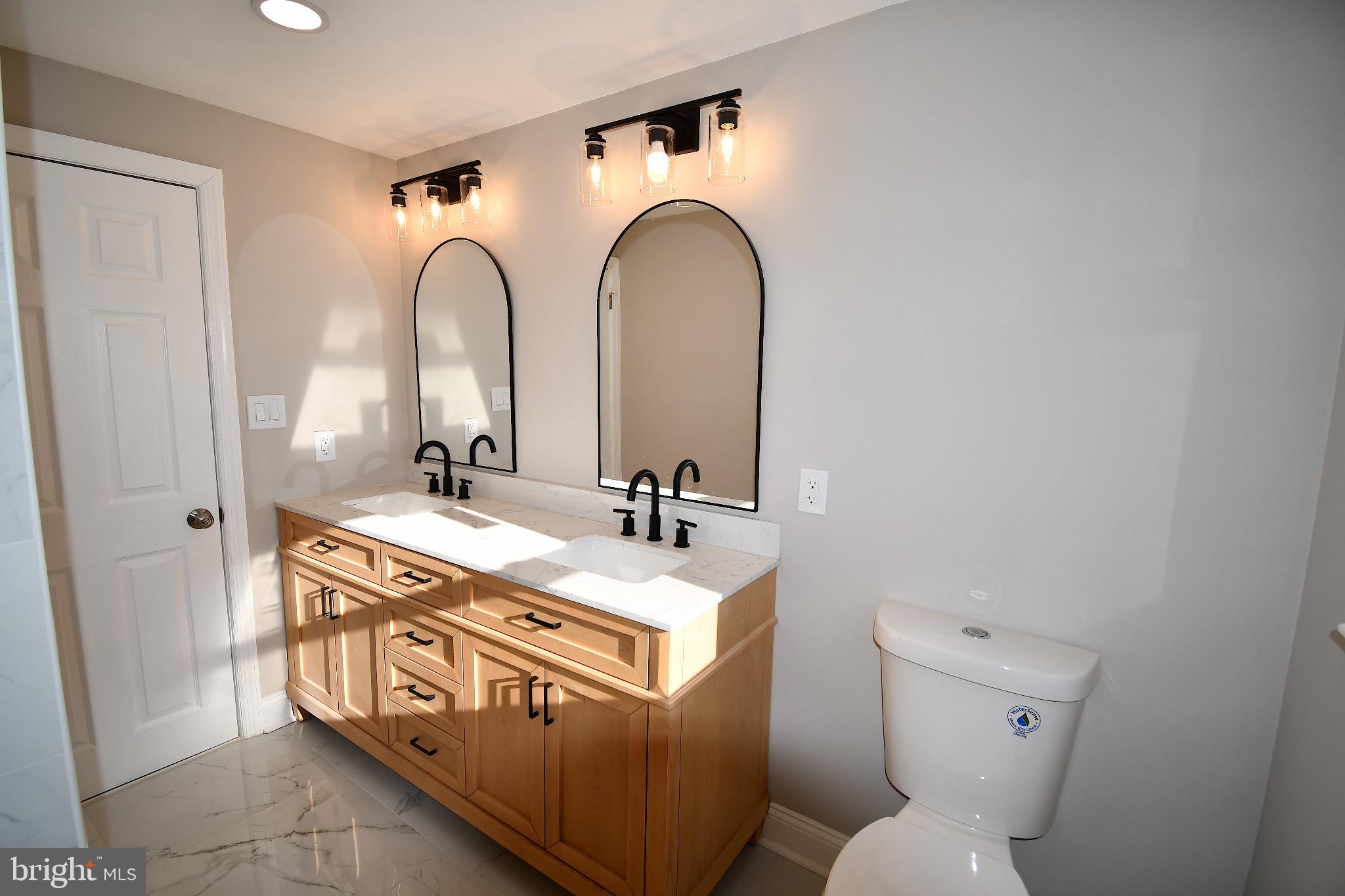 25 Champlain Road Marlton, NJ 08053 - Photo 23 of 40 Elegant bathroom with dual mirrors and light.