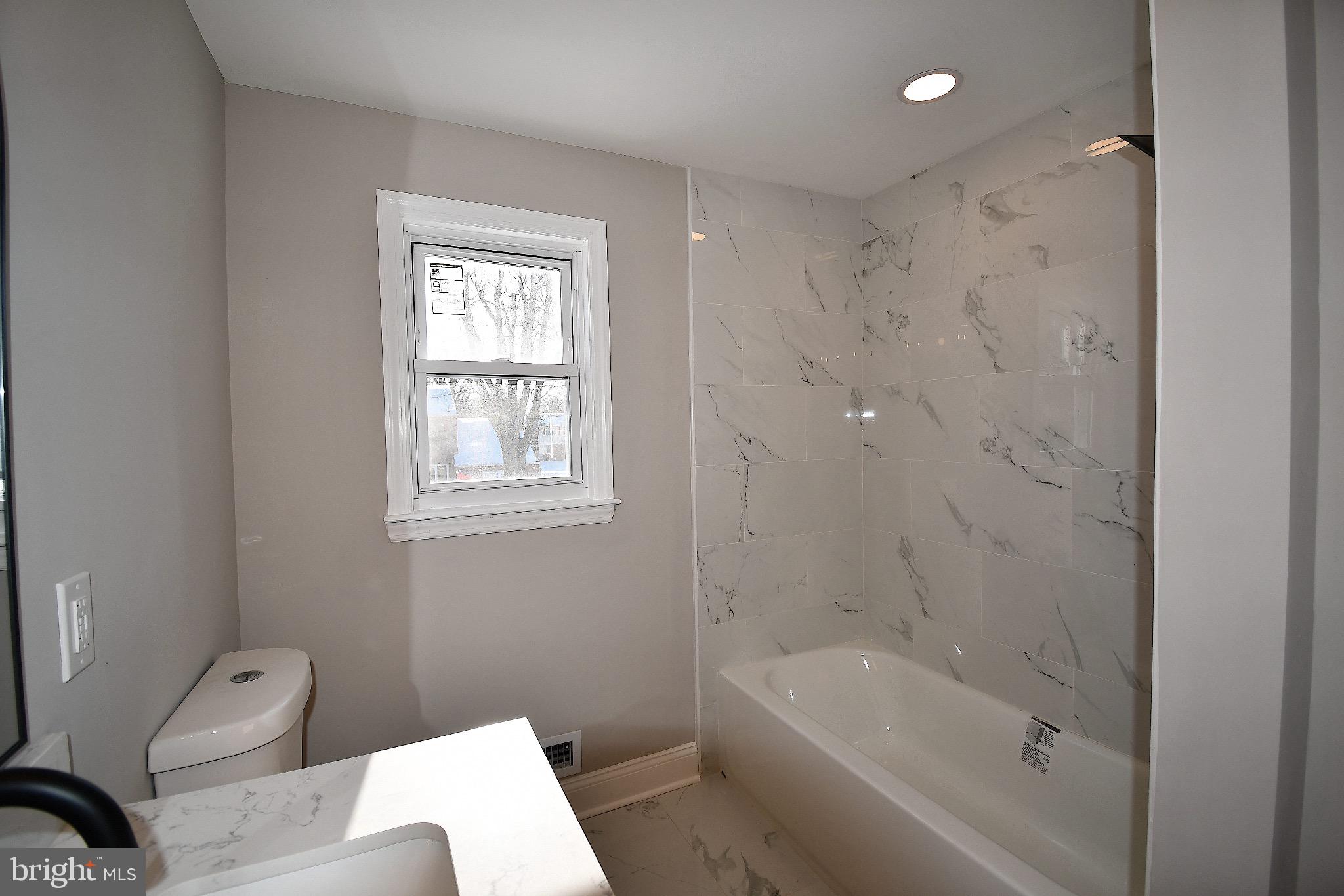 25 Champlain Road Marlton, NJ 08053 - Photo 24 of 40 Modern bathroom with elegant marble accents.