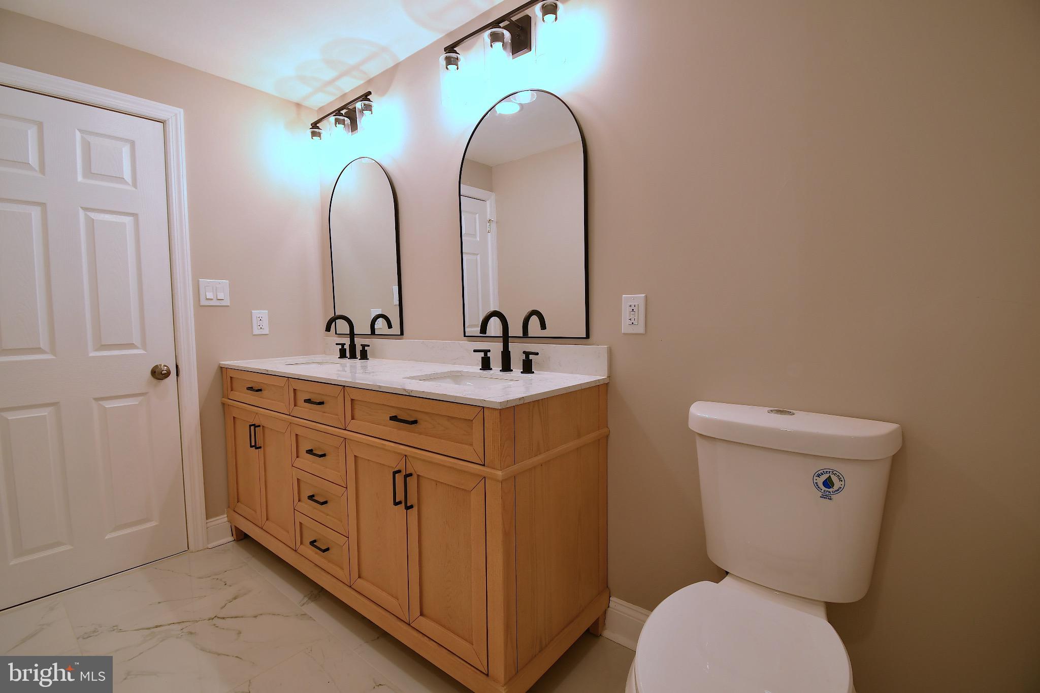 25 Champlain Road Marlton, NJ 08053 - Photo 25 of 40 Elegant dual-sink bathroom with modern fixtures.