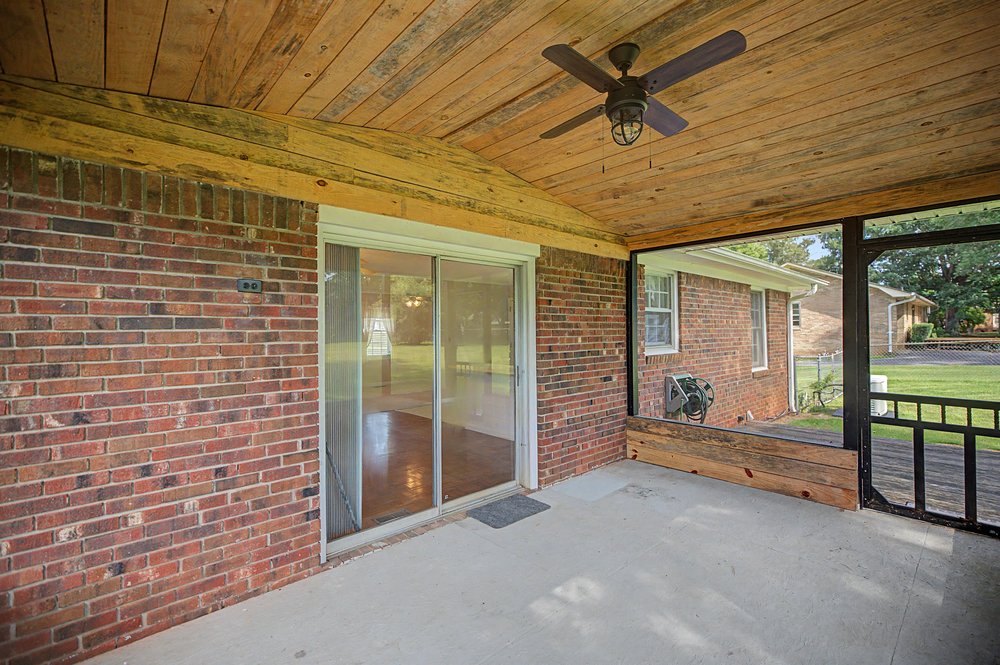 115 Brunson Drive Pickens, SC 29671 - Photo 21 of 29 Relax and unwind on this well-appointed screened porch with a durable wood-paneled ceiling.