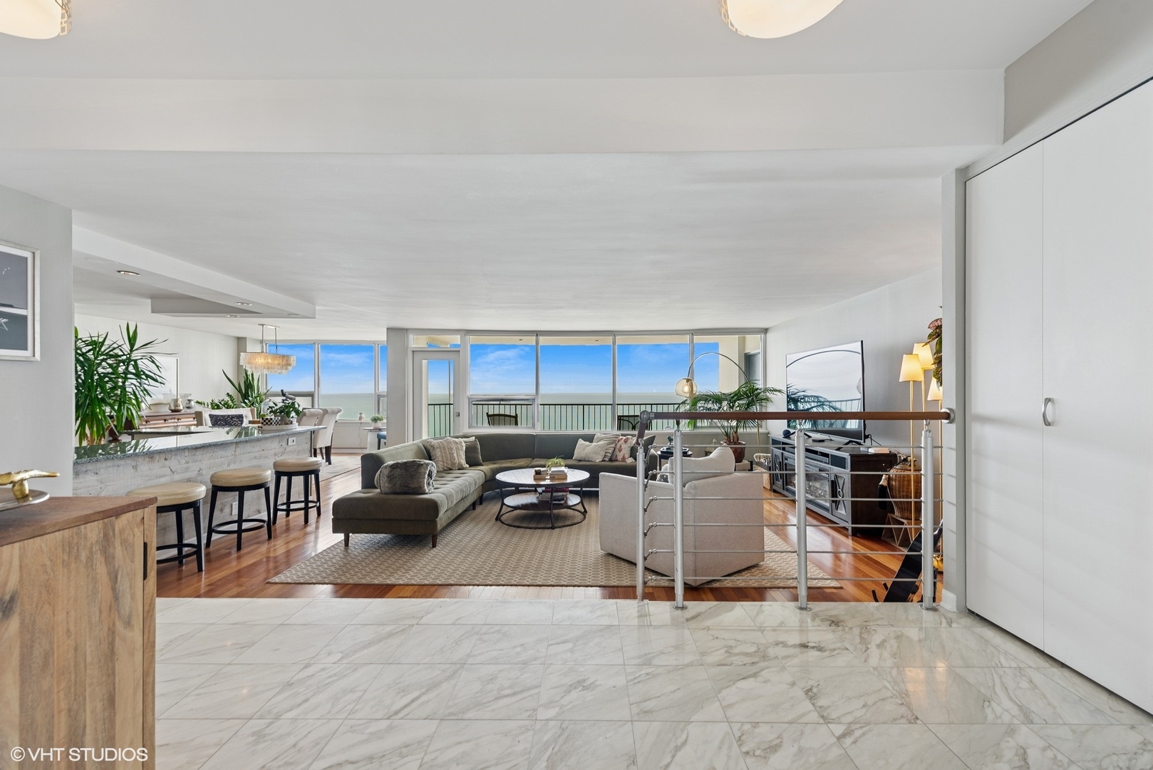 5733 North Sheridan Road, Unit 29D Chicago, IL 60660 - Photo 19 of 40 a living room with lots of furniture and clutter