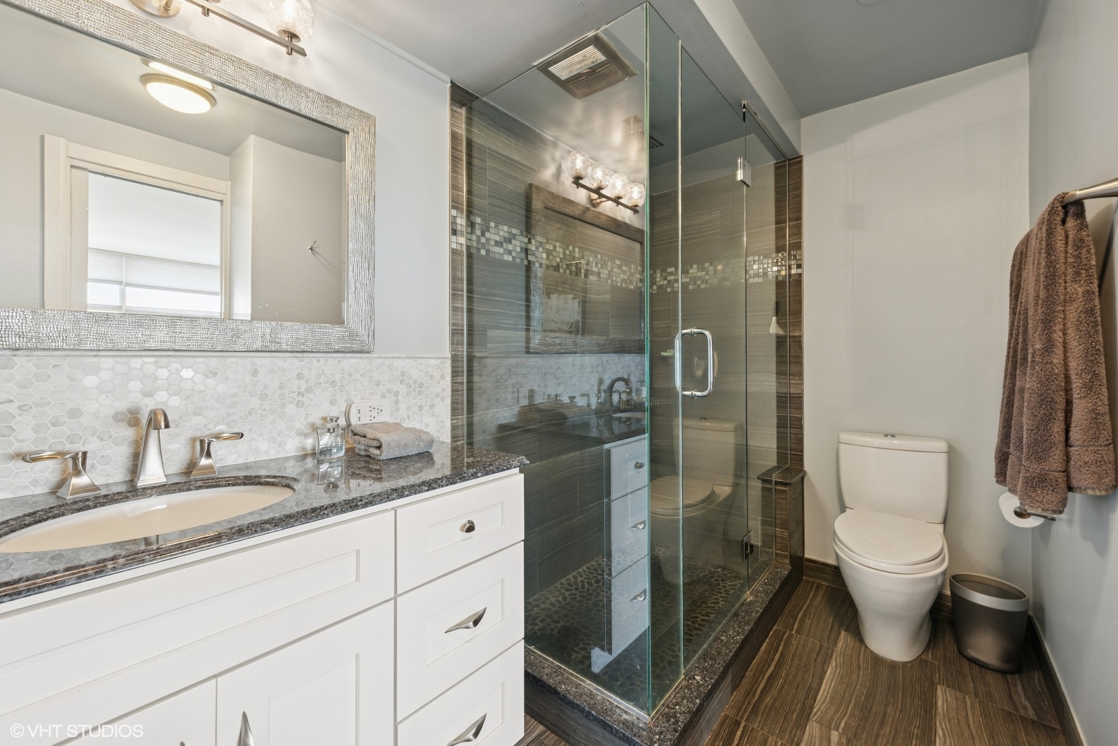 5733 North Sheridan Road, Unit 29D Chicago, IL 60660 - Photo 23 of 40 a bathroom with a granite countertop sink toilet and shower
