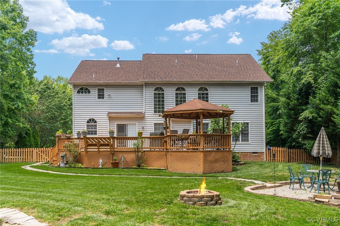 3541 Kings Farm Drive Midlothian, VA 23113 - Photo 45 of 49 a front view of a house with a yard table and chairs