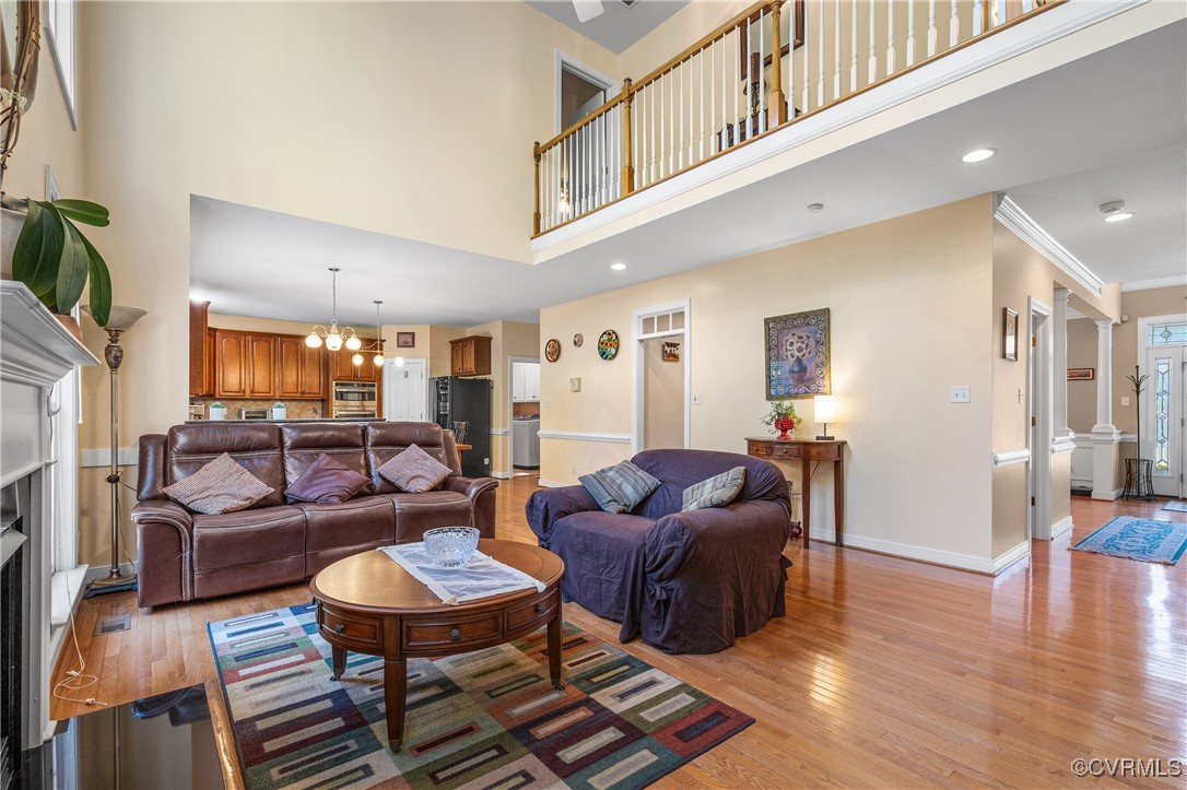 3541 Kings Farm Drive Midlothian, VA 23113 - Photo 9 of 49 a living room with furniture a fireplace and a table