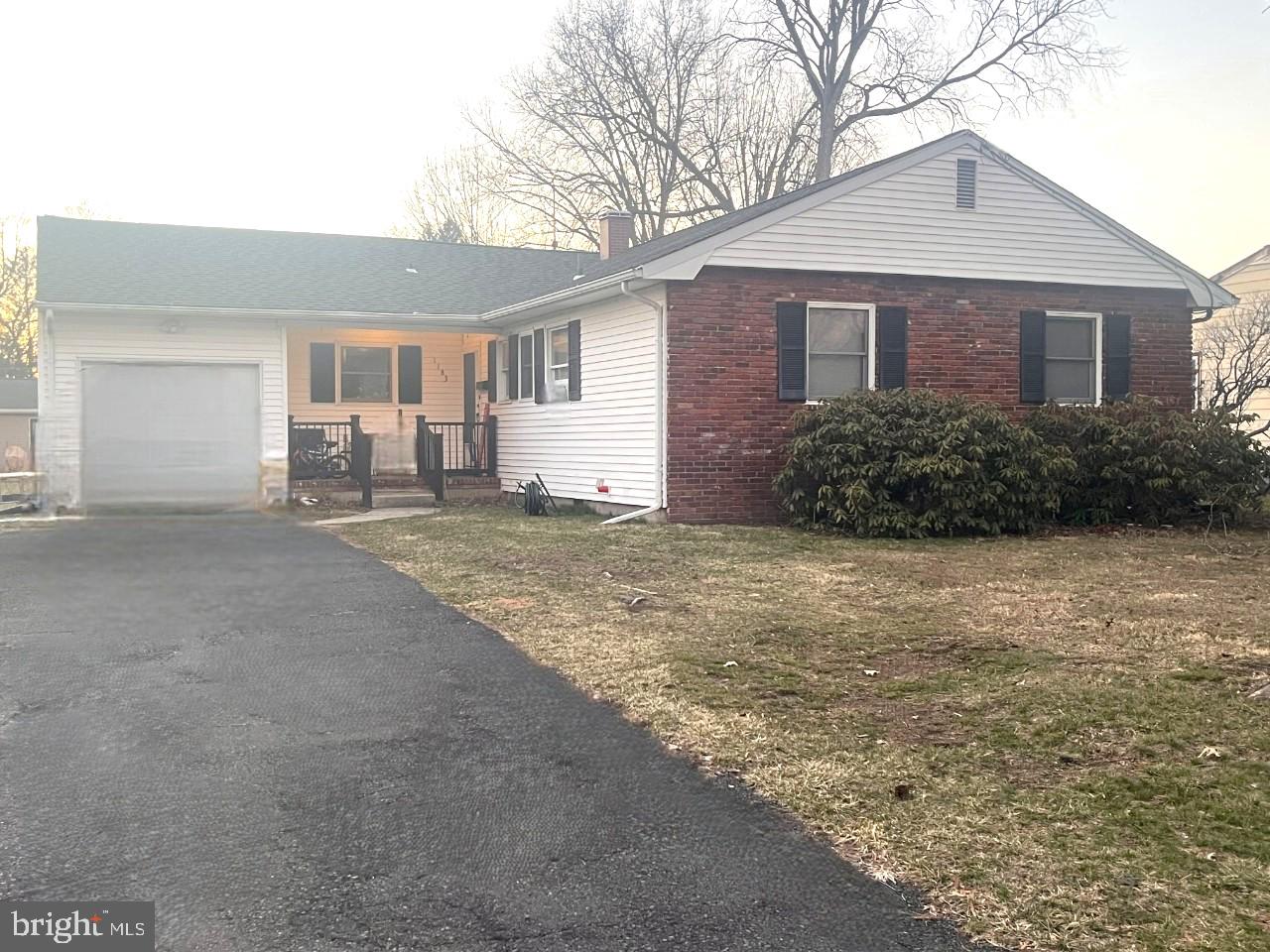 1183 Lower Ferry Road Trenton, NJ 08618 - Photo 1 of 1 a front view of a house with a garden