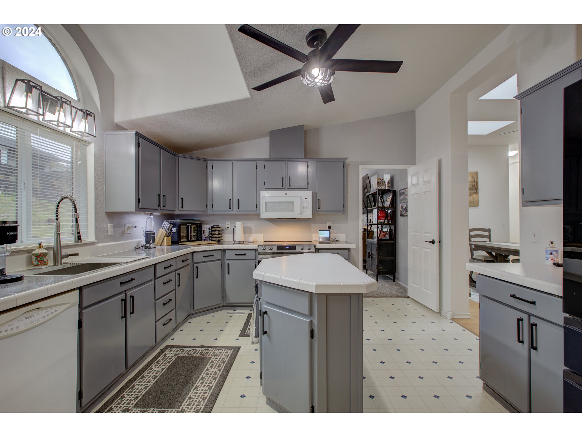 2665 Whistlers Park Road Roseburg, OR 97470 - Photo 11 of 48 a kitchen with a sink stainless steel appliances and cabinets