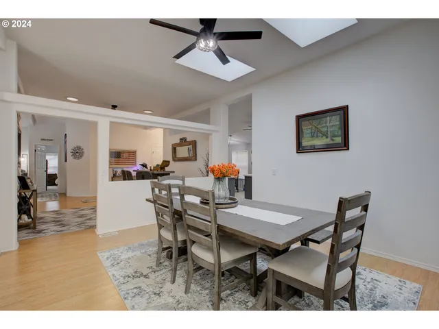 a dining room with furniture and window