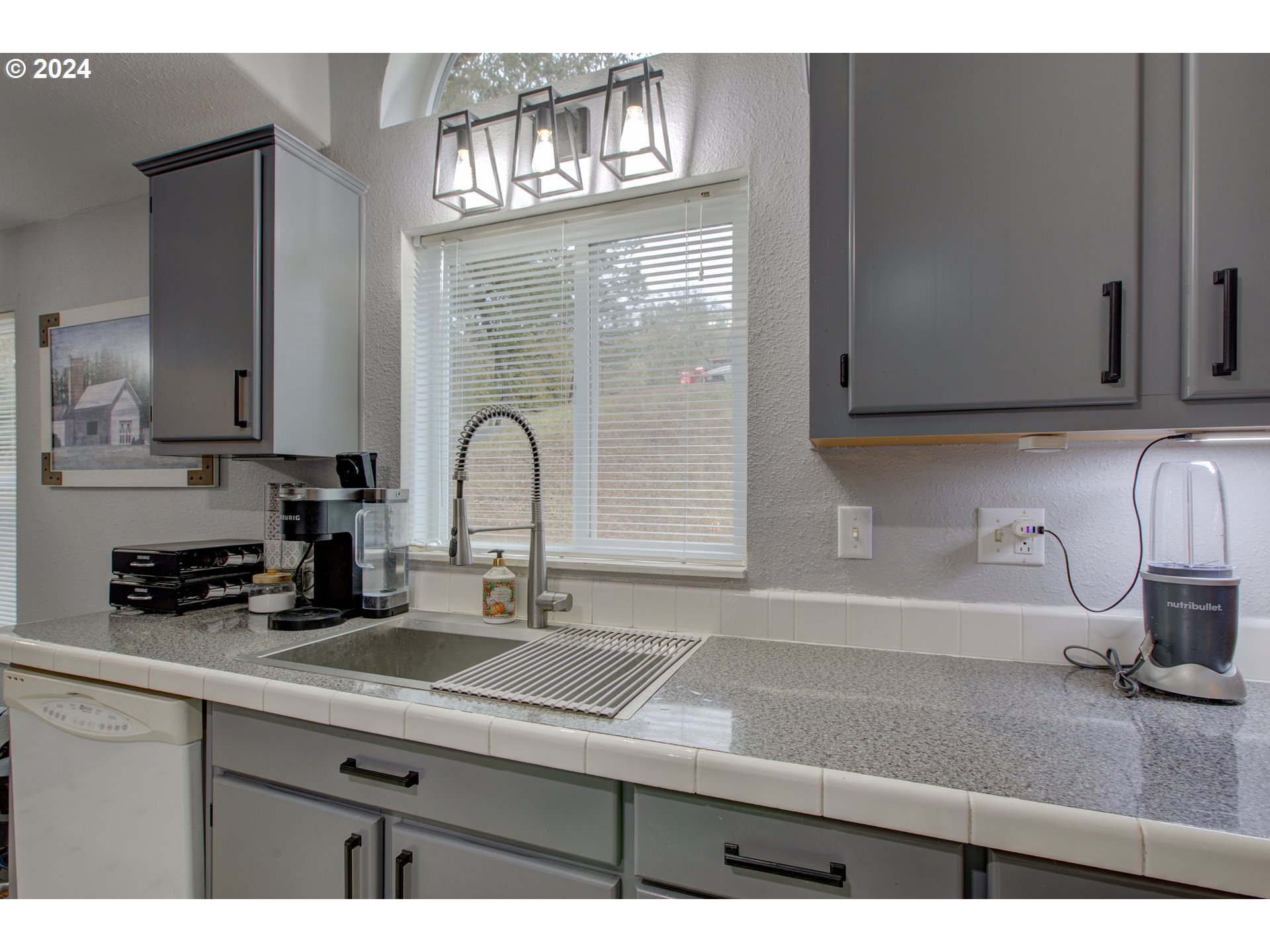 2665 Whistlers Park Road Roseburg, OR 97470 - Photo 27 of 48 a kitchen with a sink and cabinets