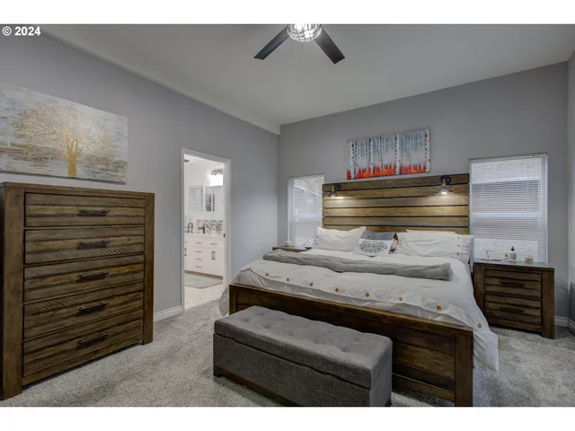 a room with furniture and a ceiling fan