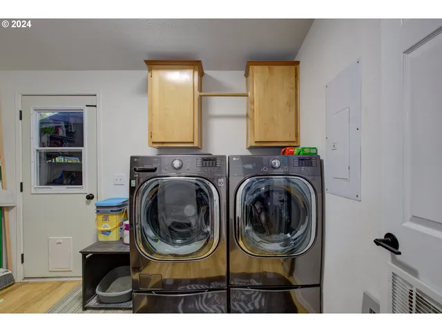 a utility room with dryer and washer