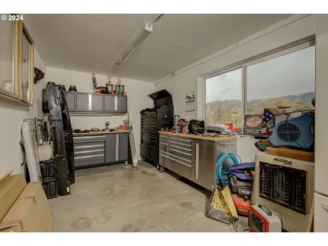 a kitchen with a sink appliances and cabinets