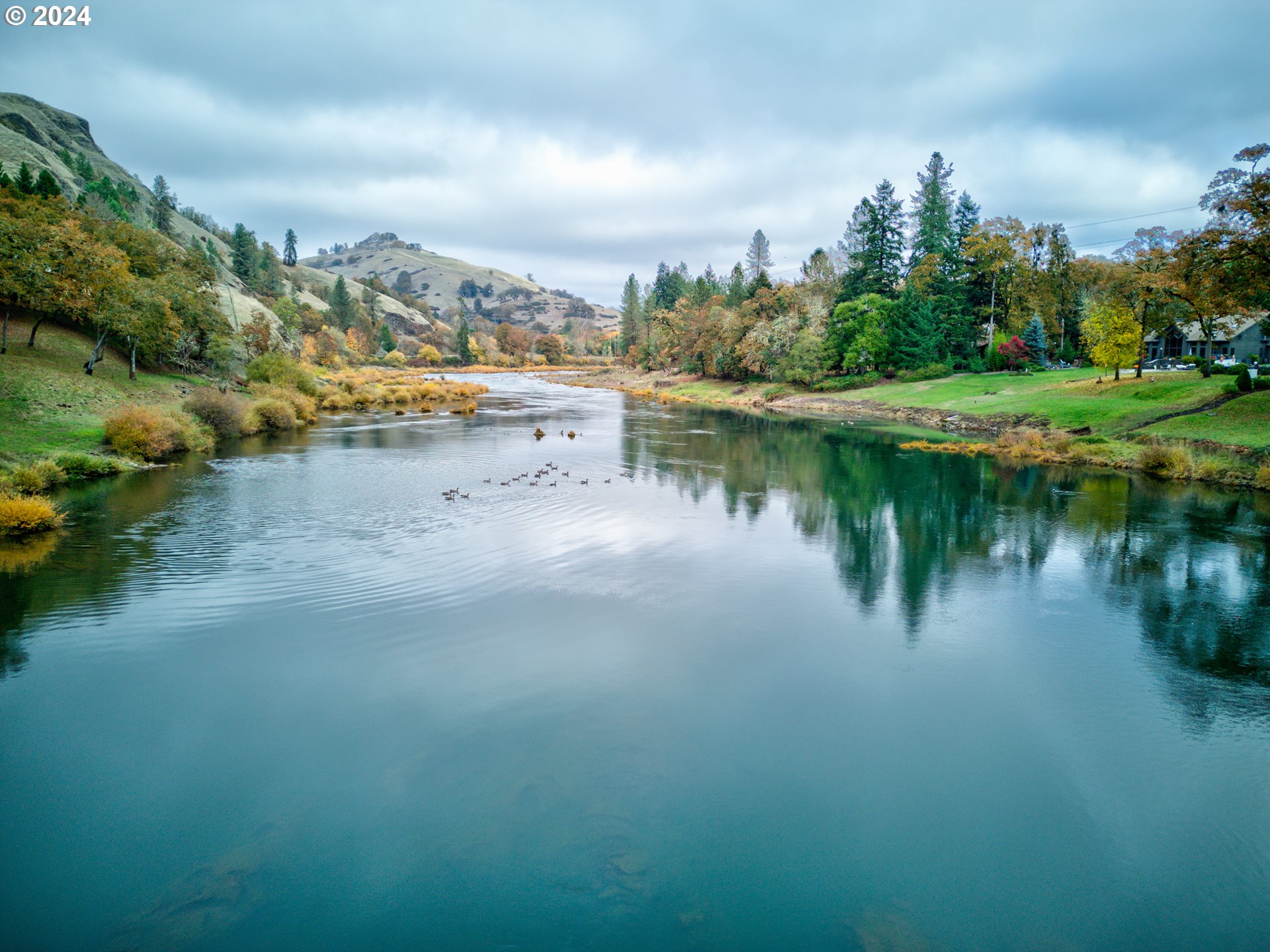 2665 Whistlers Park Road Roseburg, OR 97470 - Photo 48 of 48 a view of a lake with houses in the back