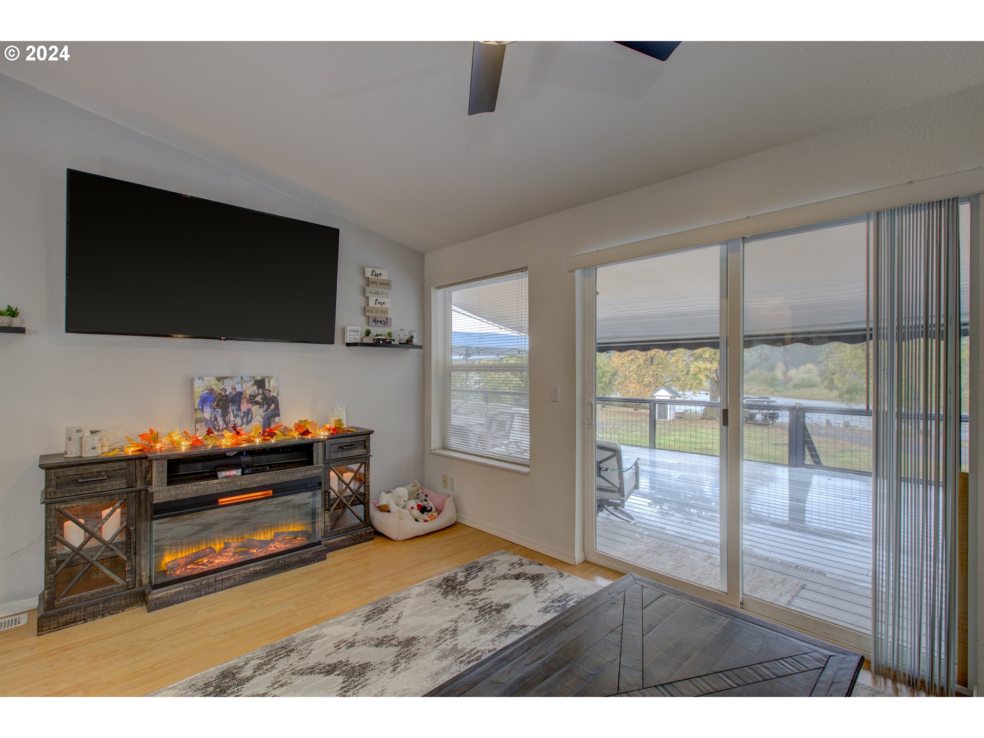 2665 Whistlers Park Road Roseburg, OR 97470 - Photo 8 of 48 a living room with furniture and a flat screen tv