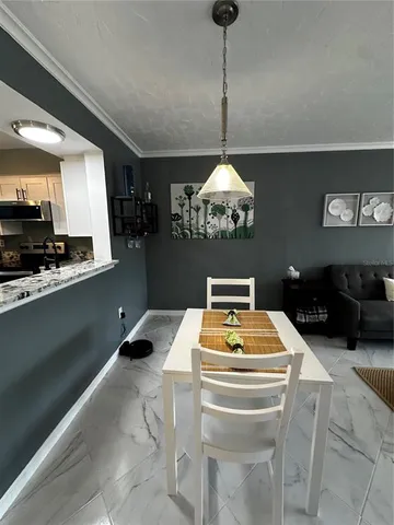 a room with furniture and chandelier